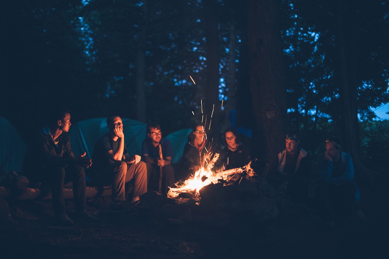 Family enjoying a warm campfire together in Okutama.