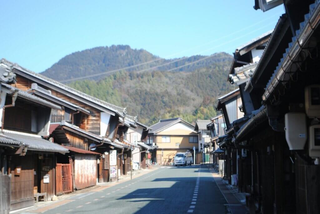 a street with a mountain in the background